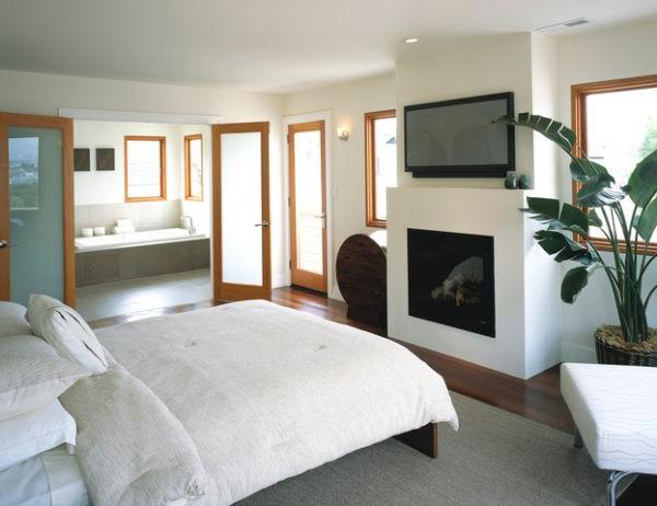 Modern bedroom with a trendy and harmoniously fitted fireplace