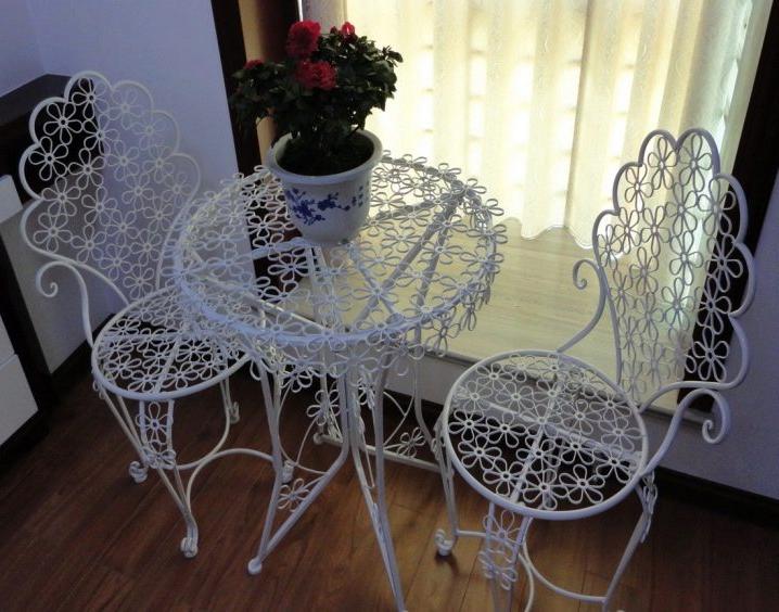 white wrought-iron table