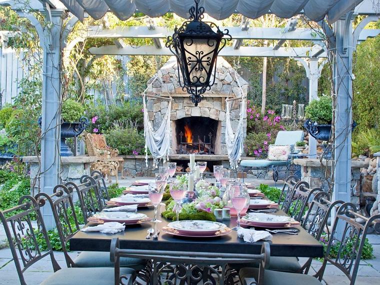 Beautiful garden with outdoor dining area and stone fireplace