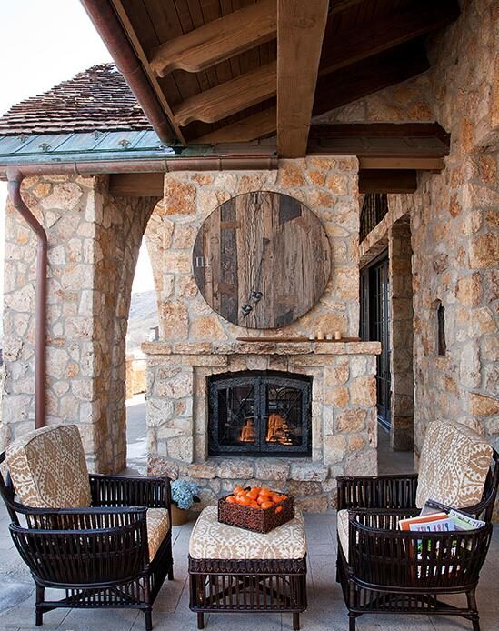 This large, ornate fireplace has become the centerpiece of this charming patio.