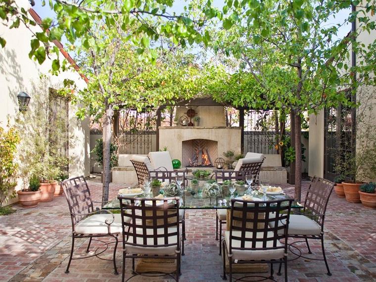 garden with a fireplace with very original steel furniture