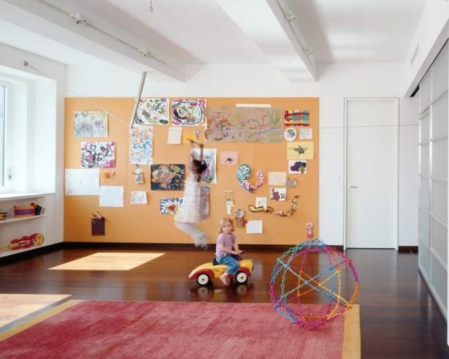 Spacious children's room with a dedicated cork wall