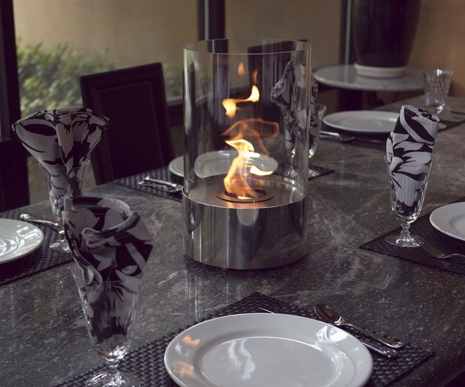 A glass cylinder with fire will complement the table setting and create a cozy atmosphere