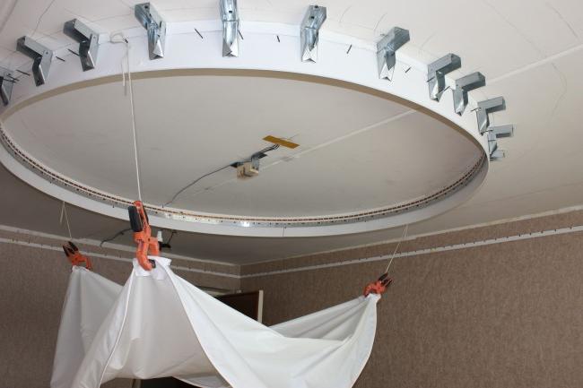 Installation of a stretch ceiling can be done by hand