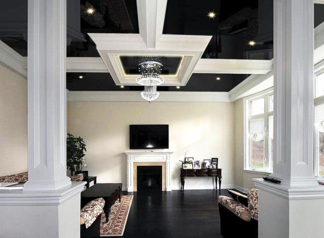 Living room with a stretch ceiling in a classic style