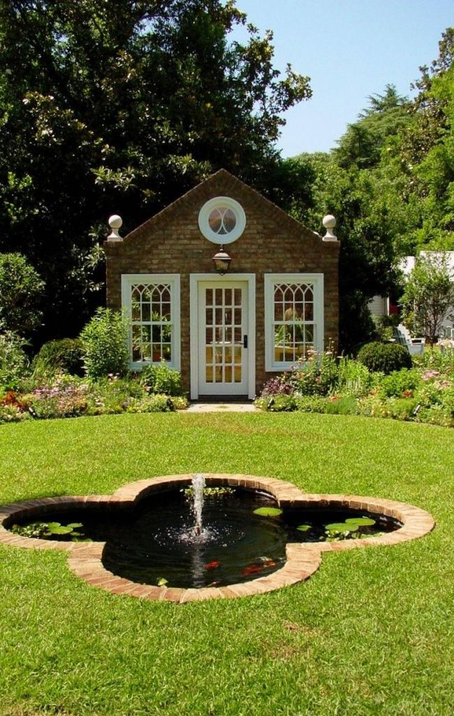 Pond with tiles around the edges and a fountain